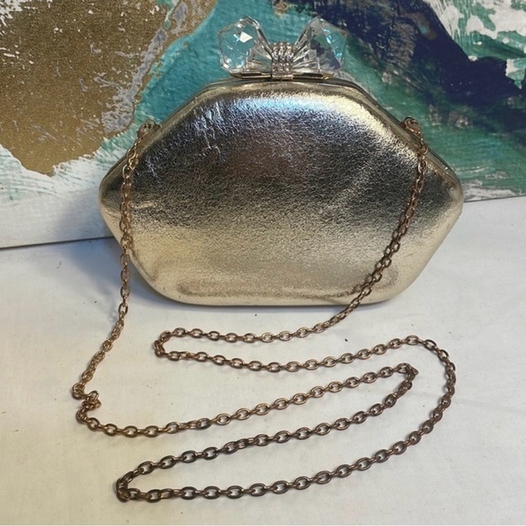 Charming Charlie Handbags - RSVP/Charming Charlie Metallic Gold Clutch with crossbody strap